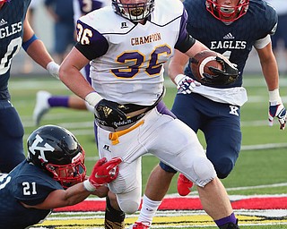 WAREEN, OHIO -August 25, 2018: CHAMPION FLASHES vs JOHN. F. KENNEDY EAGLES at Mollenkopf Stadium, Warren, OH-  Champion Flashes' Austin Willforth (36) rushes for a 1st down as JFK Eagles' Nick Fordeley (21) defends during the 2nd qtr.  MICHAEL G. TAYLOR | THE VINDICATOR