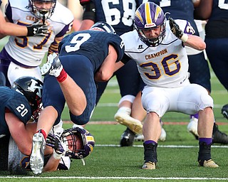 WAREEN, OHIO -August 25, 2018: CHAMPION FLASHES vs JOHN. F. KENNEDY EAGLES at Mollenkopf Stadium, Warren, OH-  Champion Flashes' Austin Willforth (36) and Logan Ainsley (57) stop  JFK Eagles' Cameron Hollobaugh (9) during the 2nd qtr.  MICHAEL G. TAYLOR | THE VINDICATOR