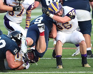 WAREEN, OHIO -August 25, 2018: CHAMPION FLASHES vs JOHN. F. KENNEDY EAGLES at Mollenkopf Stadium, Warren, OH-  Champion Flashes' Austin Willforth (36) and Logan Ainsley (57) stop  JFK Eagles' Cameron Hollobaugh (9) during the 2nd qtr.  MICHAEL G. TAYLOR | THE VINDICATOR