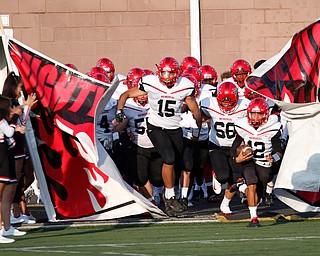 Campbell runs onto the field at the start of their game against Valley Christian Saturday night at Dave Pavlansky Field in Poland. EMILY MATTHEWS | THE VINDICATOR