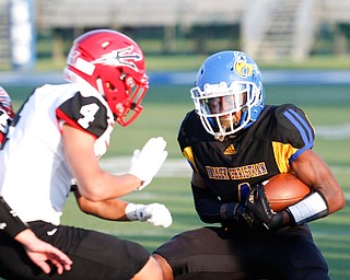 Valley Christian's Tyrone Lindsey tries to get past Campbell's Nikita Klimis during the first half of their game Saturday night at Dave Pavlansky Field in Poland. EMILY MATTHEWS | THE VINDICATOR