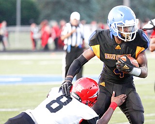 Valley Tyrone Lindsey gets past Campbell's Malachi Bannarn during the first half of their game Saturday night at Dave Pavlansky Field in Poland. EMILY MATTHEWS | THE VINDICATOR