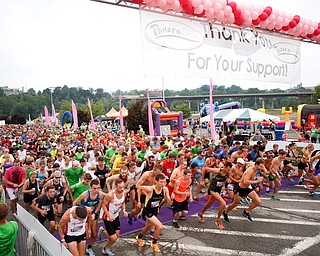 Runners participating in the 10k race take off at the starting line at Panerathon outside of Covelli Centre on Sunday. .EMILY MATTHEWS | THE VINDICATOR