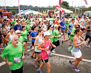 Runners participating in the 10k race take off at Panerathon outside of Covelli Centre on Sunday. .EMILY MATTHEWS | THE VINDICATOR