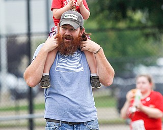 Danny Young, of Kinsman, and his son Orry Young cheer on 10k runners on Walnut Street during Panerathon on Sunday. .EMILY MATTHEWS | THE VINDICATOR