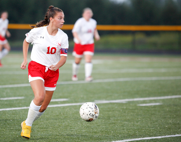 Niles McKinley's Jaycee Ward kicks the ball down the field during the game against South Range Monday night at South Range.