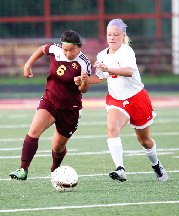 South Range's Marie DePascale and Niles McKinley's Ella Perrone fight over the ball during the game Monday night at South Range.