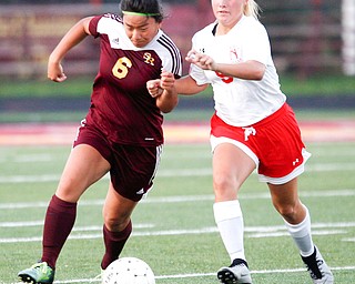 South Range's Marie DePascale and Niles McKinley's Ella Perrone fight over the ball during the game Monday night at South Range.