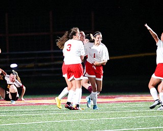 Niles McKinley celebrates after Jaycee Ward scores in the second half to get them in the lead 4-3 against South Range Monday night at South Range.