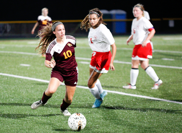 South Range's Anna Finocchi tries to kept the ball away from Niles McKinley during their game Monday night at South Range.