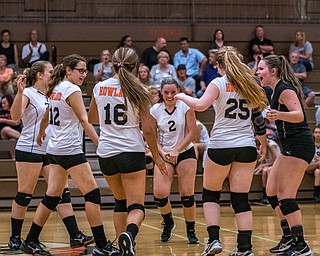 DIANNA OATRIDGE | THE VINDICATOR The Howland volleyball team celebrates after scoring a point during their match against Boardman in Howland on Tuesday. The Spartans won the match 3-0.