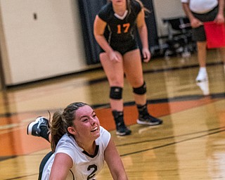 DIANNA OATRIDGE | THE VINDICATOR Howland's Bailee Beasom (2) digs the ball as her teammate Haley Vandergrift (17) looks on during their match versus Boardman on Tuesday. The Spartans won 3-0.