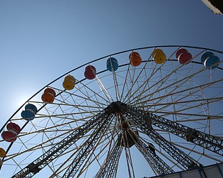  ROBERT K.YOSAY  | THE VINDICATOR..the 172  Canfield Fair is underway at the fairgrounds in Canfield- 52 rides and hundreds of vendors are ready for the traditional end of summer festivities..The 120 foot ferris gondola wheel that can seat 142 at a fine.