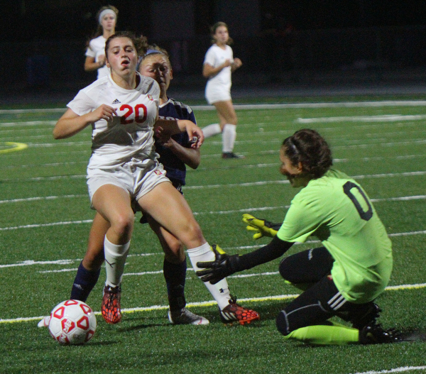 William D. Lewis The vindicator Mooney's keeper(0) and (20) block a shot from Fitch's (7) during 8-29-18 action at Fitch.