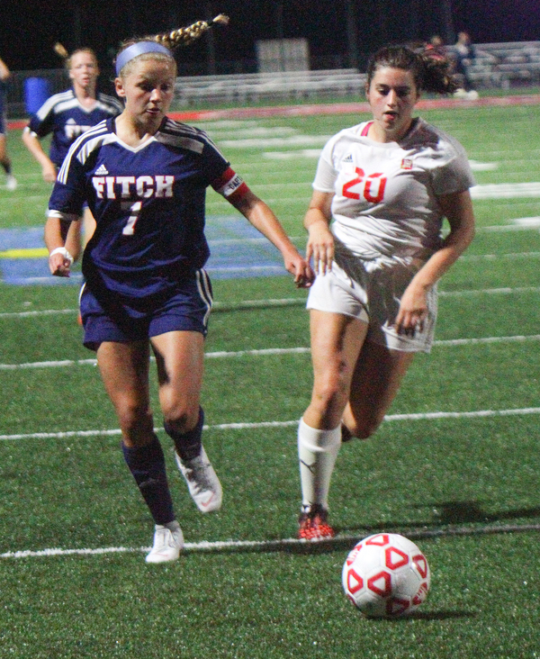 William D. Lewis The vindicator Mooney's(20) and Fitch's (7) go for the ball during 8-29-18 action at Fitch.