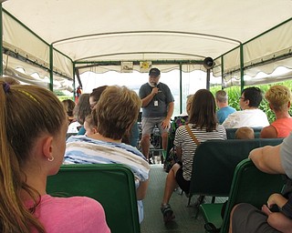 Neighbors | Jessica Harker.Tour guide Bill Gilmour taught people about the MetroParks Farms and animals and crops that are there on Aug. 2.