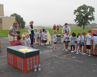 Neighbors | Jessica Harker.Children learned street crossing safety by walking through the safety village on Aug. 9 at Glenwood Junior High School during the annual Safety Village event.