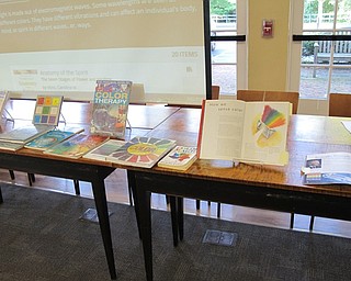 Neighbors | Jessica Harker.A book display about color as energy and how light relates to color and ties into the chakras was on display during the Aug. 10 Color Your World event.