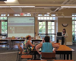 Neighbors | Jessica Harker.Hayley McEwing showed those gathered at the Color Your World event the list she created of books related to the theme, color as energy, on August 10.