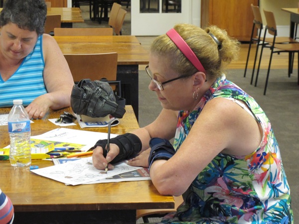 Neighbors | Jessica Harker.Sue Moderalli colored her page during the August 10 Color Your World event at the Poland library.
