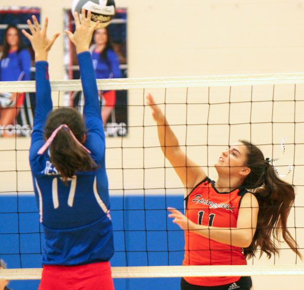 William D. Lewis The Vindicator Western Reserve's Taylor Mayorga(17) tries to block a shot from Springfield'sZoeRenaldy(11) during 8-30-18 asction at Western Reserve.