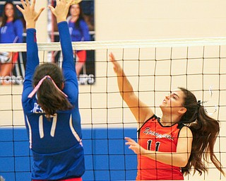 William D. Lewis The Vindicator Western Reserve's Taylor Mayorga(17) tries to block a shot from Springfield'sZoeRenaldy(11) during 8-30-18 asction at Western Reserve.