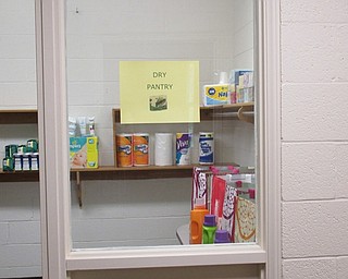 Neighbors | Jessica Harker.A sign hangs outside of the paper goods pantry August 20 where community members in need go to recieve good thats average government assistance does not cover.