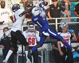 William D. Lewis The Vindicator  Hubbard'sJayQuab Odem(1) intercepts a pass intended for Girard'sTerrance Davis(14) during 8/31/18 action at Hubbard.