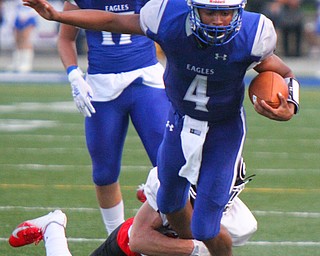William D. Lewis The Vindicator  Hubbard's Davion Daniles(4) is stopped by a Girard defender during 8/31/18 action at Hubbard.