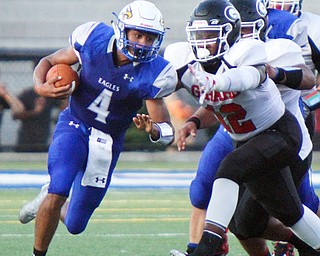 William D. Lewis The Vindicator  Hubbard's Davion Daniels (4) eludes Girard's Daryl Smith Jr. (12) during the Aug. 31 game at Hubbard.