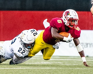 DIANNA OATRIDGE | THE VINDICATOR Cardinal Mooney's Dom Byrd is tackled by Akron Hoban's Luke Bauer after picking up a first down during their game at Stambaugh Stadium in Youngstown on Friday night.