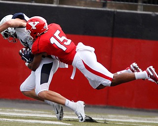 YSU's Avery Larkin tackles Butler's Pace Temple during the first half of their opening game on Saturday.