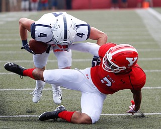 YSU's Bryce Gibson tackles Butler's Pace Temple during the first half of the game on Saturday.