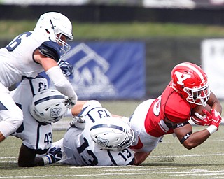 YSU's Christian Turner goes down with the ball during the first half of the game on Saturday.