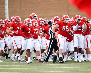 The YSU football team runs onto the field for their first game of the season against Butler on Saturday.