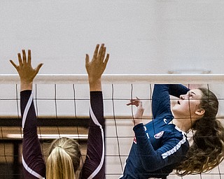 DIANNA OATRIDGE | THE VINDICATORÊ Austintown Fitch's Chelsie Wheeler goes up for a kill against the defense of Boardman's Madi Ricciuti during their AAC match in Boardman on Tuesday. Boardman rallied to win 3-2.