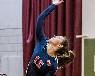 DIANNA OATRIDGE | THE VINDICATOR Austintown Fitch's Alyssa Leskovac jump serves during their AAC match versus Boardman on Tuesday. The Spartans rallied to win 3-2..