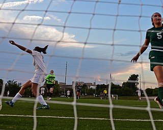 YOUNGSTOWN, OHIO - SEPTEMBER 5, 2018: Boardman's Serene Khatib, left, celebrates after scoring a goal while Ursuline's Kenzie Larch shows her frustration during the second half of their game on Wednesday night at the Youngstown State soccer complex. DAVID DERMER | THE VINDICATOR