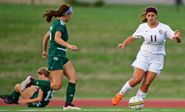 YOUNGSTOWN, OHIO - SEPTEMBER 5, 2018: Boardman's Lilly Essad dribbles away from Ursuline's Kenzie Larch and Megan Wilson during the second half of their game on Wednesday night at the Youngstown State soccer complex. DAVID DERMER | THE VINDICATOR