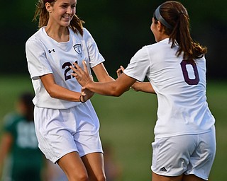 YOUNGSTOWN, OHIO - SEPTEMBER 5, 2018: Boardman's Serene Khatib, right, is congratulated by teammate Ashley Harding after scoring a goal during the second half of their game on Wednesday night at the Youngstown State soccer complex. DAVID DERMER | THE VINDICATOR