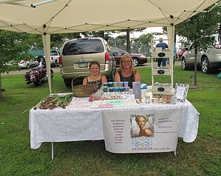 Neighbors | Jessica Harker.Representatives from the Goddess Salon set up a tent selling various goods during the Aug. 6 Heritage Day event at the Austintown Farmers Market.