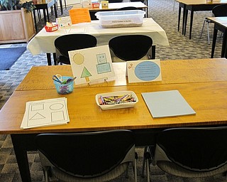 Neighbors | Jessica Harker.One station was set up at the Getting Ready for Kindergarten event at the Austintown library where children used different shapes to create a picture.