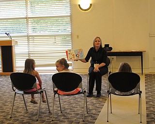 Neighbors | Jessica Harker.Librarian Lindsay Cramer read "Kindergarten is Cool," to children gathered at the Aug. 8 Getting Ready for Kindergarten event.