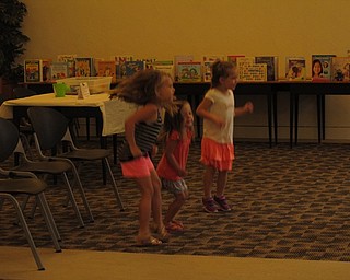 Neighbors | Jessica Harker.Children in attendence at the Getting Ready for Kindergarten event danced to a song being played by librarians to help them gain listening and instruction following skills before entering school.