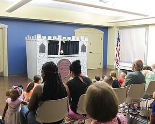 Neighbors | Jessica Harker .Those in attendance watched as the story of Humpty Dumpty played out on stage during the Puppets! Puppets! Puppets! event on Aug. 8.