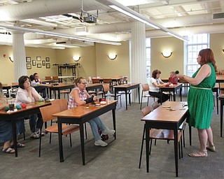 Neighbors | Jessica Harker .Librarian Missy Williams explained the project to everyone who was gathered at the August 20 crafting event at the Poland branch.