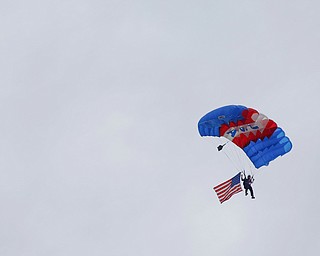 Jimmy Drummond, of Youngstown, skydives at the Austintown Patriot Day ceremony outside of Quaker Steak and Lube in Austintown on Thursday. EMILY MATTHEWS | THE VINDICATOR