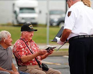 Roy Gallatin, a U.S.M.C veteran of World War ||, is honored with 12 other veterans at the Austintown Patriot Day ceremony outside of Quaker Steak and Lube in Austintown on Thursday. EMILY MATTHEWS | THE VINDICATOR