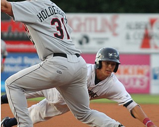 William D. Lewis The Vindicator Scrappers pitcher Tyler Freeman(7) dives back to first as Tri City's Alex Holderbach(31) misses the throw. Freeman ended up advancing to 2nd on the play. during 9-67-18 game with TriCity