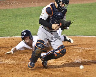 William D. Lewis The Vindicator Scrappers Clark Scolomiero(11) scores during 4th inning as Tri City catcher Oscar Campos loses the ball during 9-06-18 game with TriCity